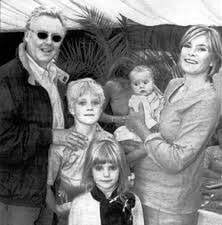 A picture of Felix Tiger Taylor's half-siblings with his dad and step-mom.